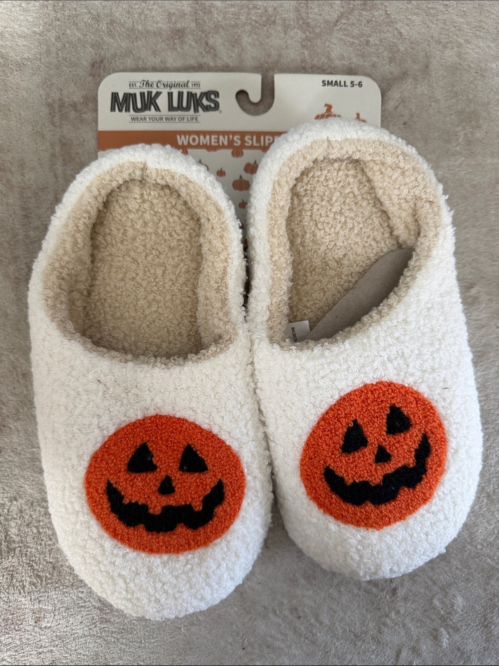 Muk Luks Women’s Cream Slip-On Slippers with Orange Jack-O'-Lanterns